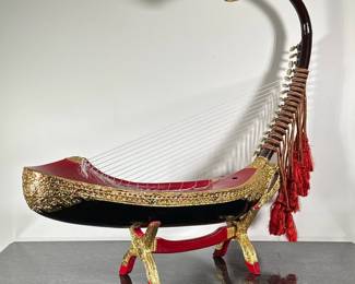 BURMESE SAUNG-GUAK HARP | Burmese Saung-guak harp on stand with gilt decoration. -  h. 32.5 x w. 8 x l. 34 in