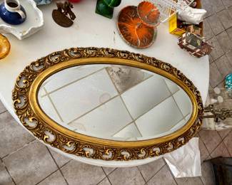 Oval shaped fancy frame mirror 
