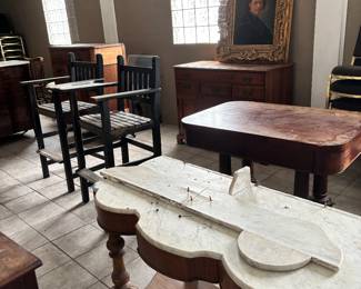 Many antique pieces of furniture 