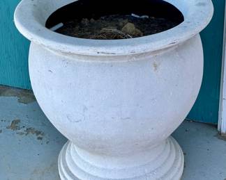 Many large cement flower pots all over the property!