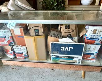 Wood and glass display cabinet with some damage on the bottom 
