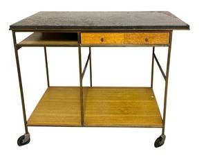 Mid Century Modern Paul McCobb Calvin Bar Cart for Calvin Furniture 

Mid Century Modern bar cart by Paul Mc Cobb for Calvin. Square tube brass frame on wheels. Wood shelves and removeable bent plywood serving tray. Two drawers and a pull out side shelf. Terrazzo top.

Measures 36 x 19 x 29 inches.
