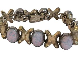 Beautiful Opal and Sterling Silver Bracelet 

Measuring about 7.5" long with the stones measuring about .75" each 