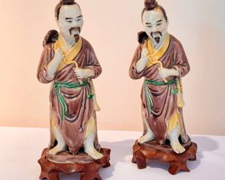 Pair of Vintage Chinese Figurines on wooden stands 

Each measuring 8" tall 