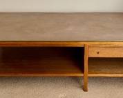 Paul McCobb for Calvin Coffee Table Leather Top Philippine Mahogany Brass Trim

Rare 1950s Paul McCobb leather top coffee table. Gorgeous Philippine mahogany, brass trim, tear drop brass pulls, pull out drawer and Calvin Grand Rapids plaque.

Some light wear to the top which is shown in the photos. There are no rips or tears in the leather. 

Measures 54" x 32" x 16" 