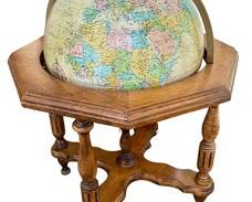 Vintage Replogle Heirloom Illuminated Globe and Wood Stand.

There is a small damaged spot that can be seen in the photos.

Measures 38” high and 28” in diameter.
