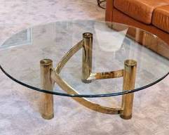 Mid Century Modern Round Brass and Glass Coffee Table.

Measures 44” in diameter and 16” high.