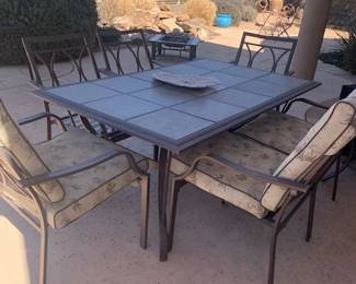3x6 table, rod iron with ceramic tiles with 6 chairs and cussions