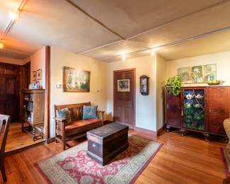 The green glass seen in the cabinet has been sold. 