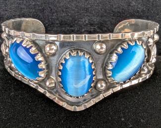 Sterling Silver And Oval Blue Cat's Eye Cabochon Bangle Bracelet With Floral Pattern 