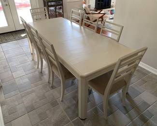 Dining table with upholstered chairs, seats 8
