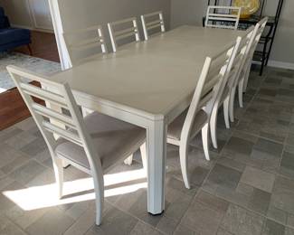 Dining table with upholstered chairs, seats 8