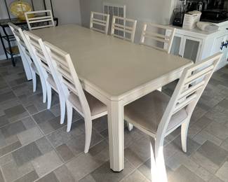 Dining table with upholstered chairs, seats 8