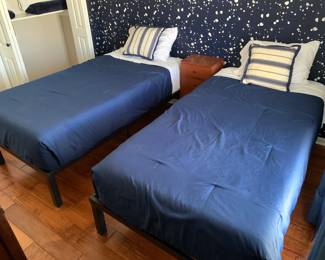 Two twin beds. Steel frames and foam mattresses in excellent condition. 