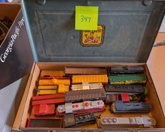 Box of vintage toy trains
