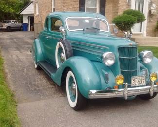 Experience classic automotive craftsmanship with this fully restored 1935 Business Coupe. This timeless vehicle has undergone a meticulous frame-off restoration, preserving its authenticity while incorporating select modern materials for enhanced durability and comfort.