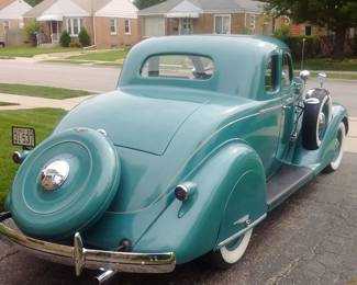 Experience classic automotive craftsmanship with this fully restored 1935 Business Coupe. This timeless vehicle has undergone a meticulous frame-off restoration, preserving its authenticity while incorporating select modern materials for enhanced durability and comfort.