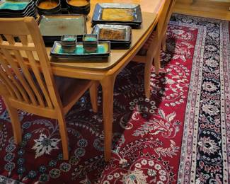 A Dining Table with 6 Chairs and Table Pads. 