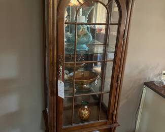 Curio cabinet with Roseville 