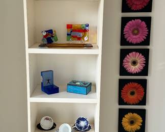 Wonderful Cream Colored Bookshelf with Adjustable Shelves Shown with an Adorable 4 Piece Plate Collection by the Taste Setter Collection, Fabulous Signed Due Zeta(Italy) Hand Painted Fused Glass Art, Kosta Boda "Starlight" Art Glass, and a Collection of Jonathan Shuff Wooden Tiles.