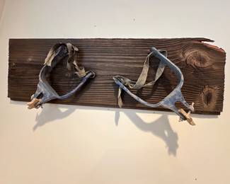 Plaster Western Spurs Painted and Mounted to a Wooden Board.