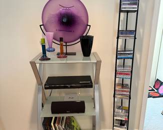 Contemporary 3-Tier Aluminum and Frosted Glass Shelf Stand, 22.25"W x 39" x 14"D, with a Selection of Blown Glass and Mixed Media.