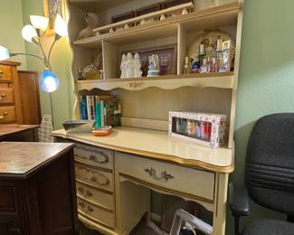 many pieces of vintage and antique furniture