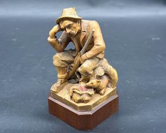 Wooden Carving of Hunter Resting on Stump & Fox