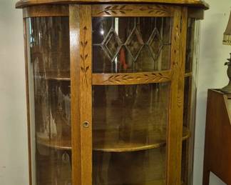 Oak curved glass display cabinet with leaded glass