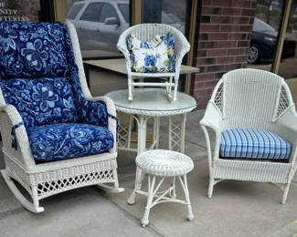 Wicker child's  and adult rockers, glass top table, chair and stool.