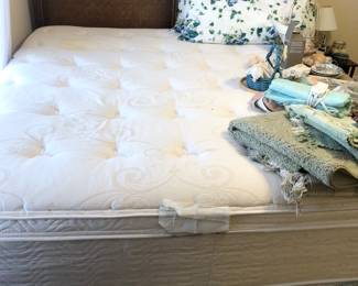 King bed with brown wicker headboard