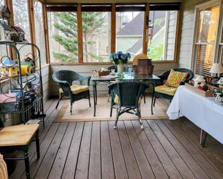 Glass top patio set with wicker chairs. Also a nice baker’s rack or plant stand. 