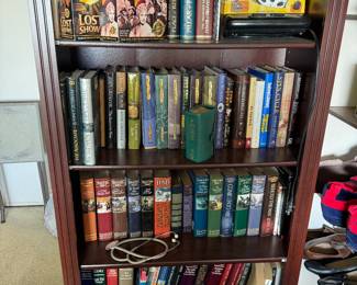 Mystery novels, books, portable dvd player, bookcase