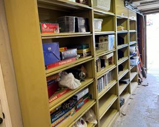 Yellow metal garage cabinets, board games- monopoly Pictionary etc. DVD, VHS,