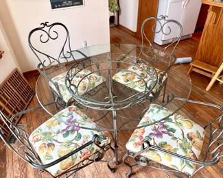 Beautiful glass top table and iron chairs