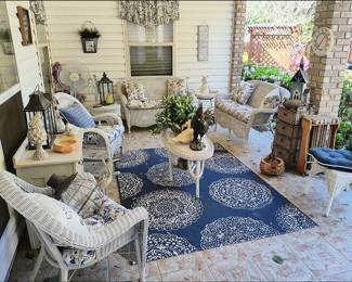 Patio with White Wicker Furniture, Outdoor Rug, Lanterns, etc.
