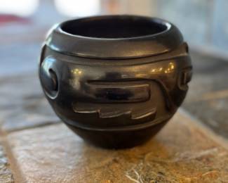 Beautiful Santa Clara Pueblo pottery by Stella Chavarria with a deep carved design