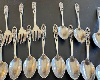 Antique set of silver filigree spoons and forks