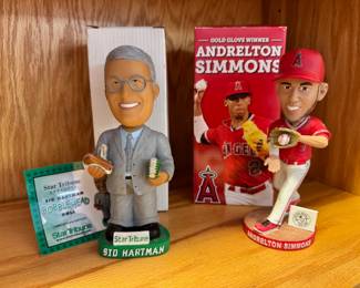 Sid Hartman and Andrelton Simmons bobbleheads