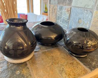 Nice collection of black-on-black jars by Octavio Andrew