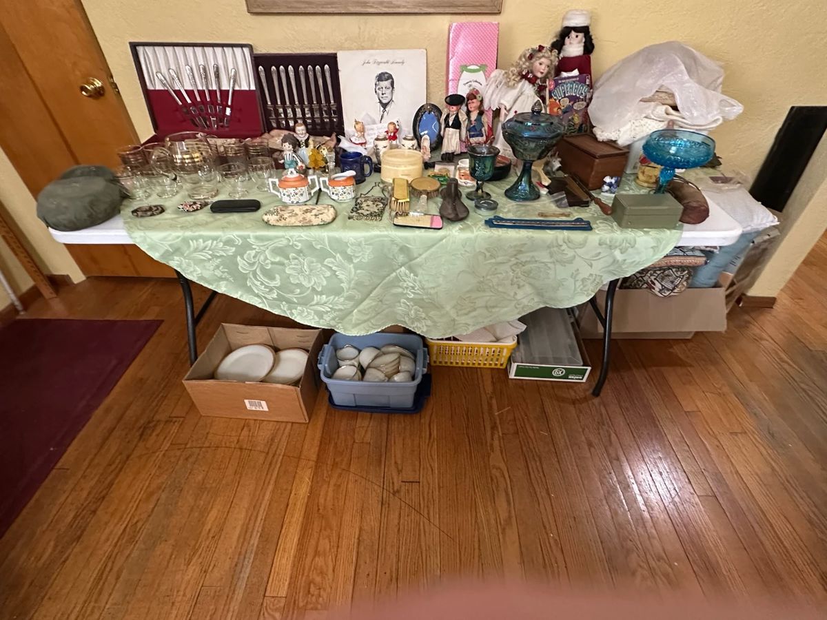 Antique military  mess kit. Whiting and davis Evening Bag. Vintage Baby Clothes. Japanese Purse. Anvil/ Eyeglasses.  1950 Vintage Pitcher with gold bands with cocktail glasses full set. Santa mug. Lefton kissing girl and boy.  Sugar bowl and creamer.