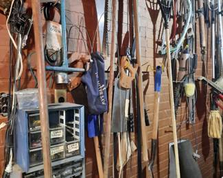 Many types of tools. Two vintage wooden yokes for oxen.