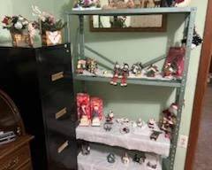 Solid wood roll top desk. Four drawer black metal filing cabinet. Antique wall mirror. Christmas decor.