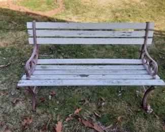 Two wood benches with iron side.