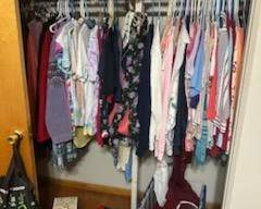 Womens clothes Medium and large/ Alfred Dunner. Jar of buttons. Clock. Ceramic lamp.Decorative pillows. Antique glass piggy bank.