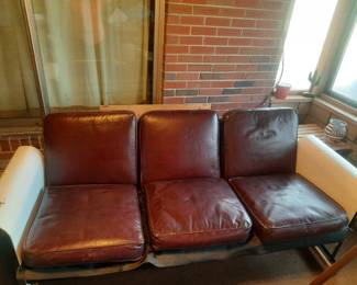 Vintage 1950 era glider. Folds out to a full size sleeping area. Original  Leather cushions.