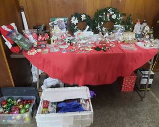 Large storage container full of gift bags. Christmas ornaments. vintage ornaments. Handmade ornaments, Christmas wreaths. Advent candle wreath. Garland. Rare ornaments, unfinished wooden cowboy boot. Alton Illinois historical ornament.