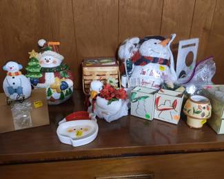Snowman and Christmas decor. Large bag of tea light candles. Two  Boxes of tealight candles in  a base for event.