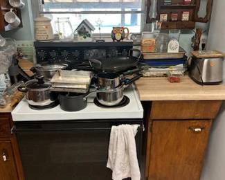 Pots pans. Vintage evenflo glass pitcher. Pyrex. Toaster. Vintage metal spice boxes. Vintage spice rack. Coffee Mugs. Coasters. Glass rolling pin. Birdhouse decor.