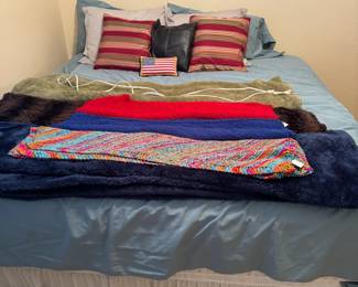 King size mattress, box springs and bed frame with pillows, crocheted small throws, faux fur and electric throws and pillows